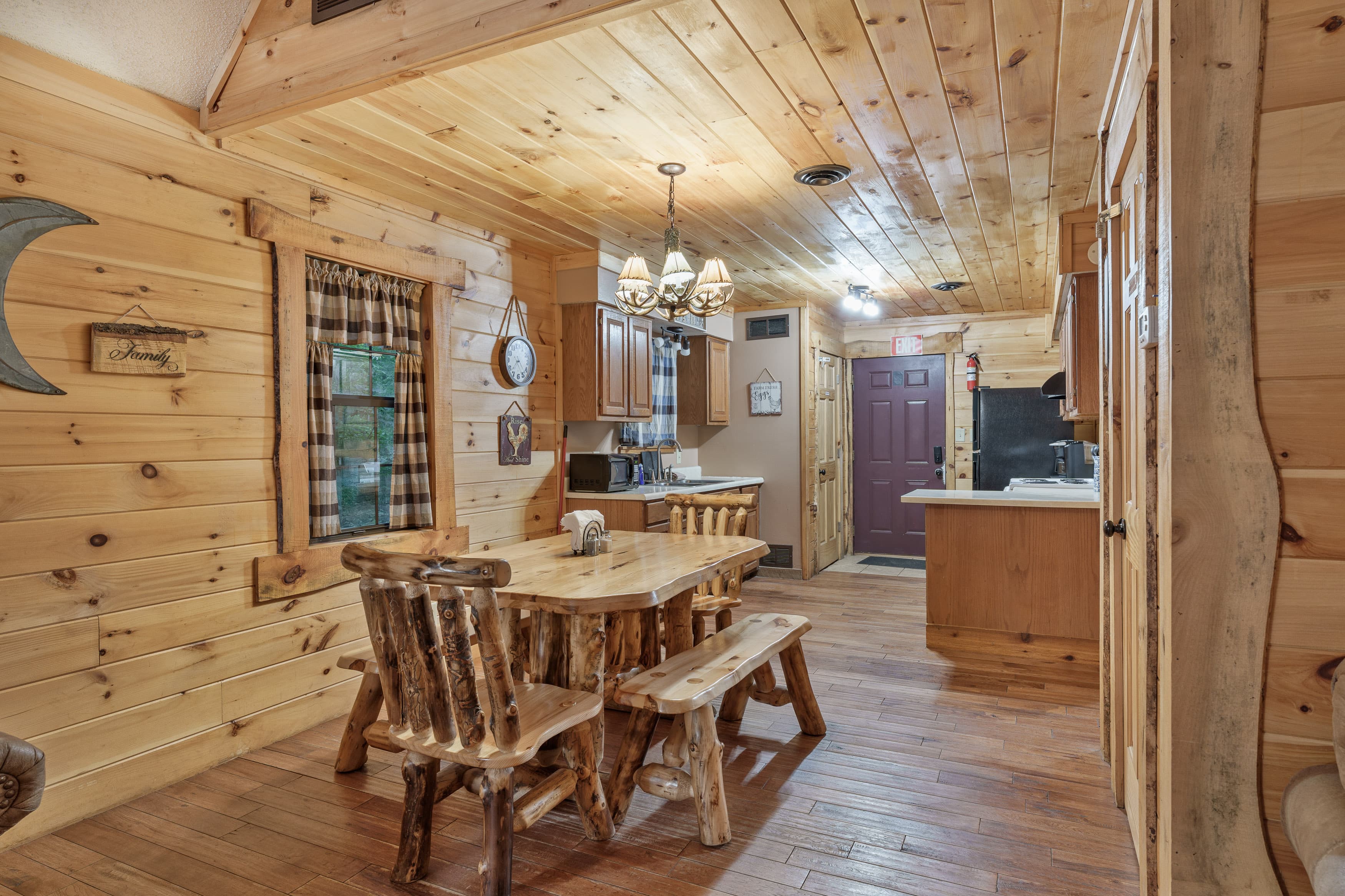 A rustic dining area with wooden furniture and a warm, cozy atmosphere.